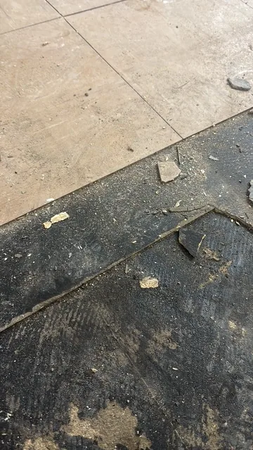 Black bitumen mastic floor removal in a SE18 flat